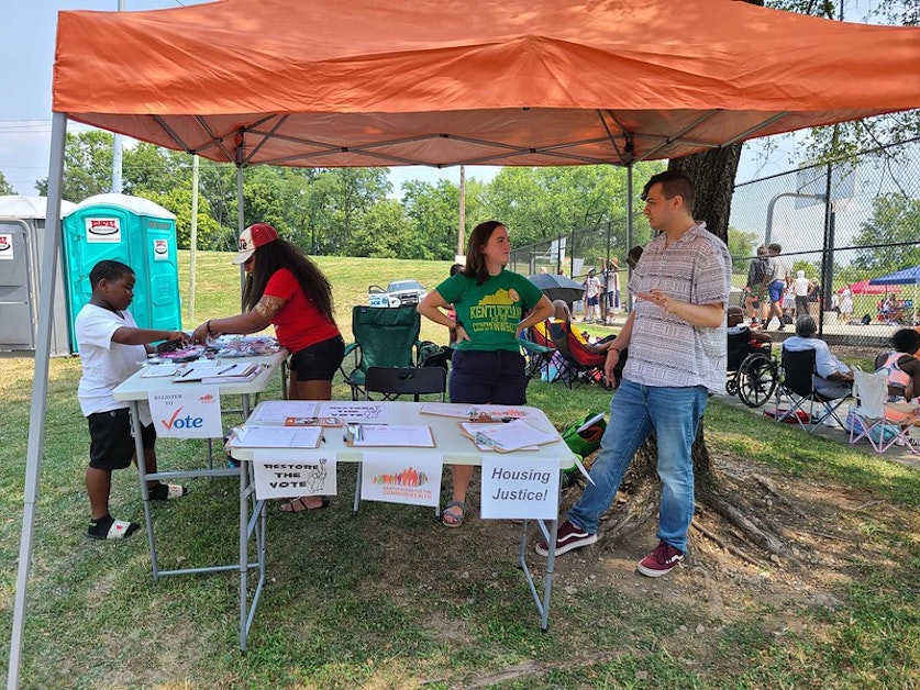 Table at Covington Cryptid Block Party · Mobilize