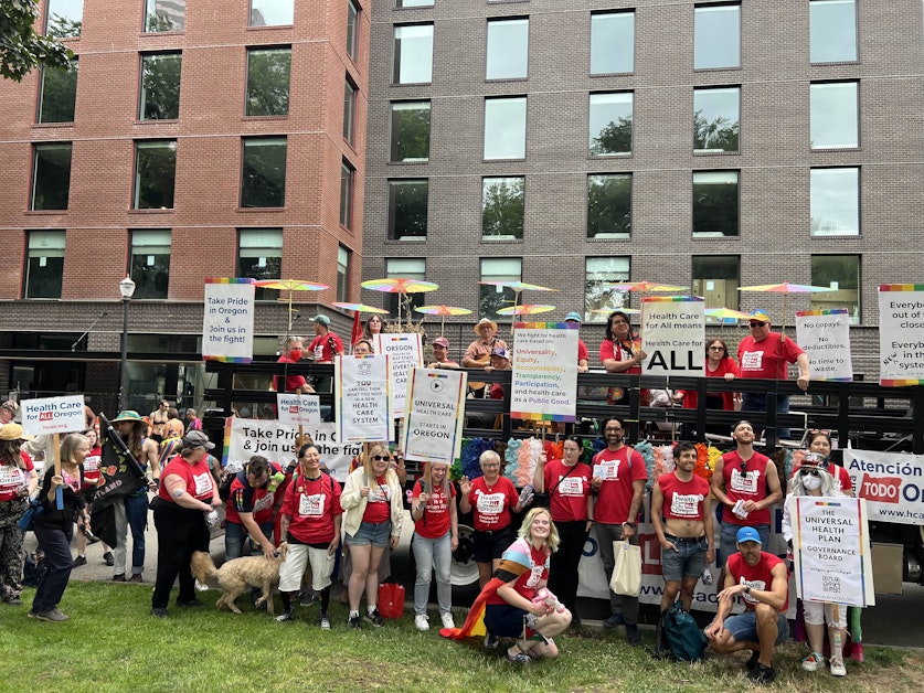 HCAO volunteers with a decorated float, preparing to march in the Portland Pride Parade
